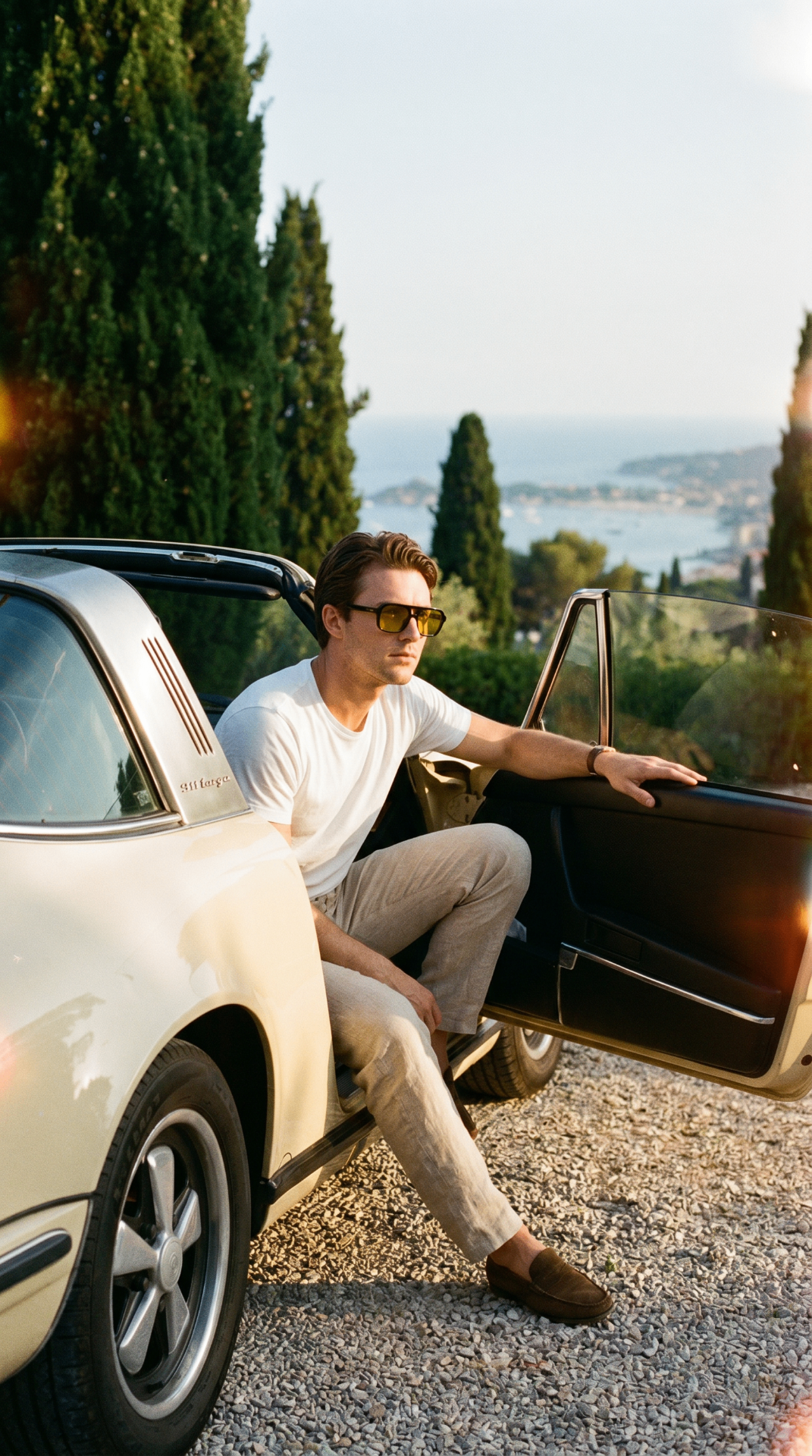 Stepping out of a vintage Porsche 911